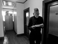 Russell, a staff member and former veteran himself, checks on the list of names that were not present for the morning roll call at the Veterans Transition House in New Bedford, MA.   PHOTO PETER PEREIRA